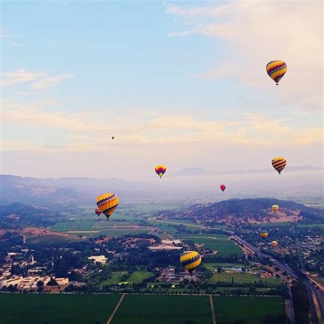 hot air balloons above the valley